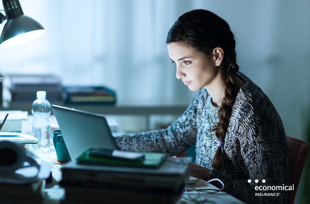 Young woman finds tips on cybersecurity tips on her laptop