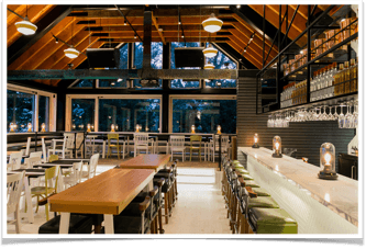 Empty dining hall with covered candles tables