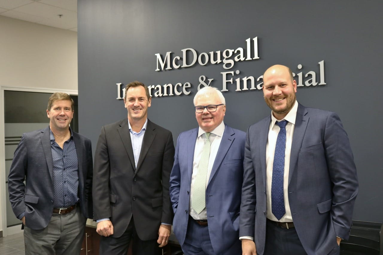 Executives standing together for McDougall Insurance top brokerage award