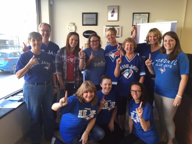 McDougall Insurance Picton branch wearing their blue jays gear