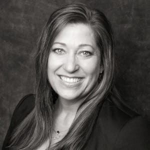 Shelly Rees smiling in black and white photo