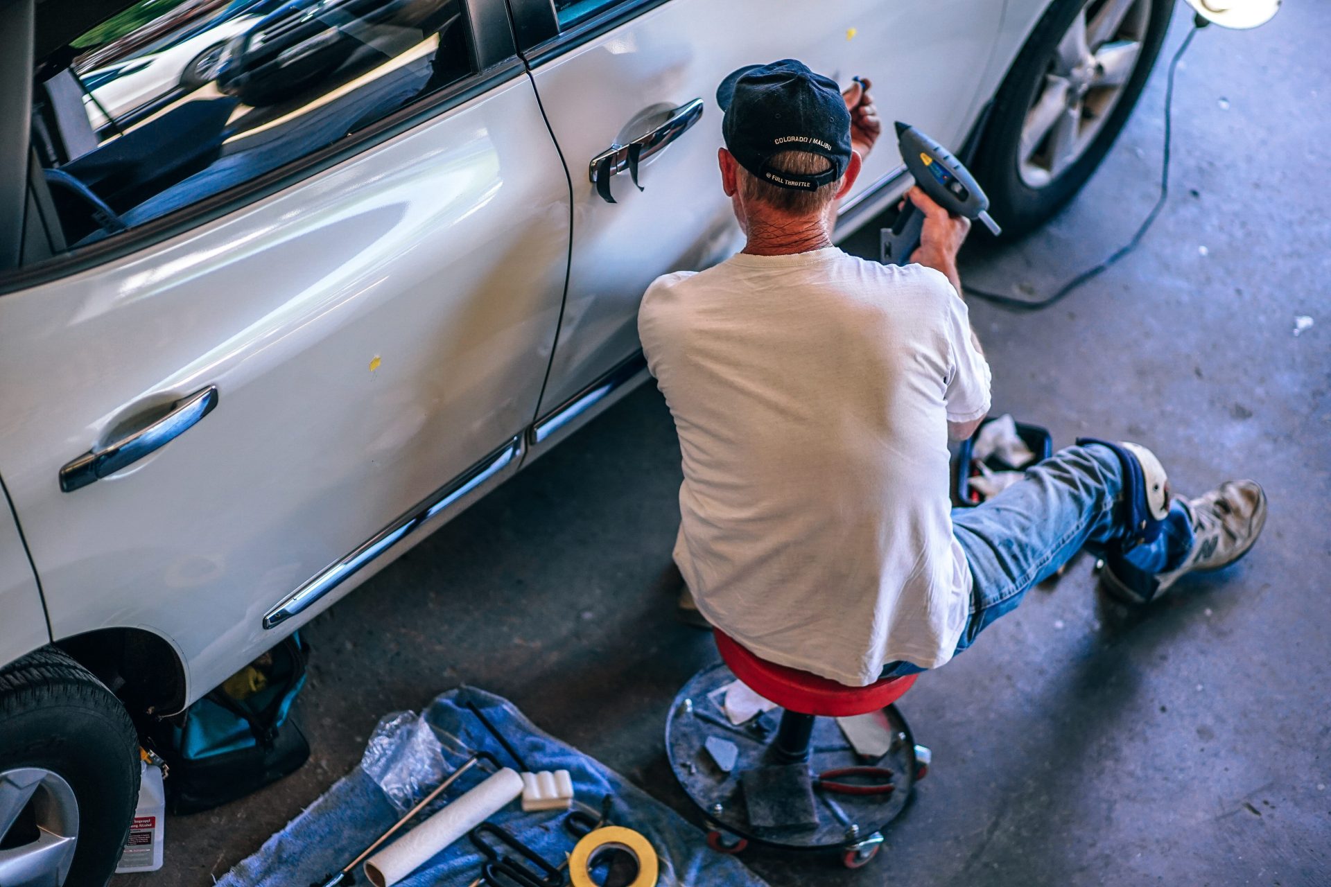 guy working in an auto body shop