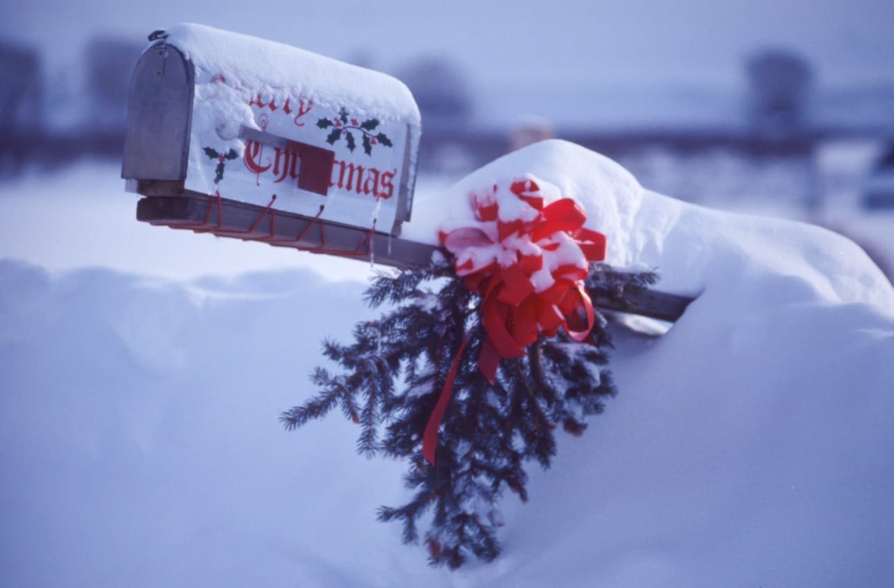 christmas mailbox covered in snow