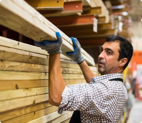 Mature man Working at a timber/lumber warehouse