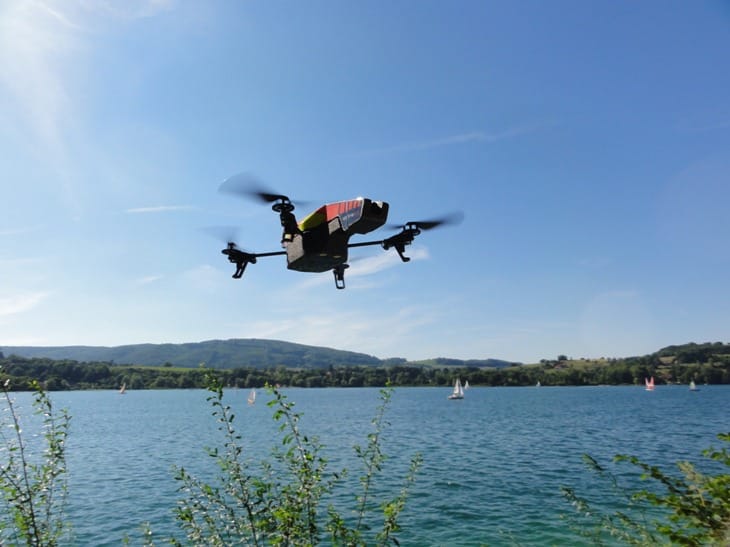 Drone hovering above the water