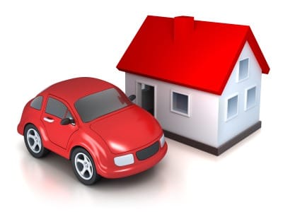 Illustration of a small red car and red roof house