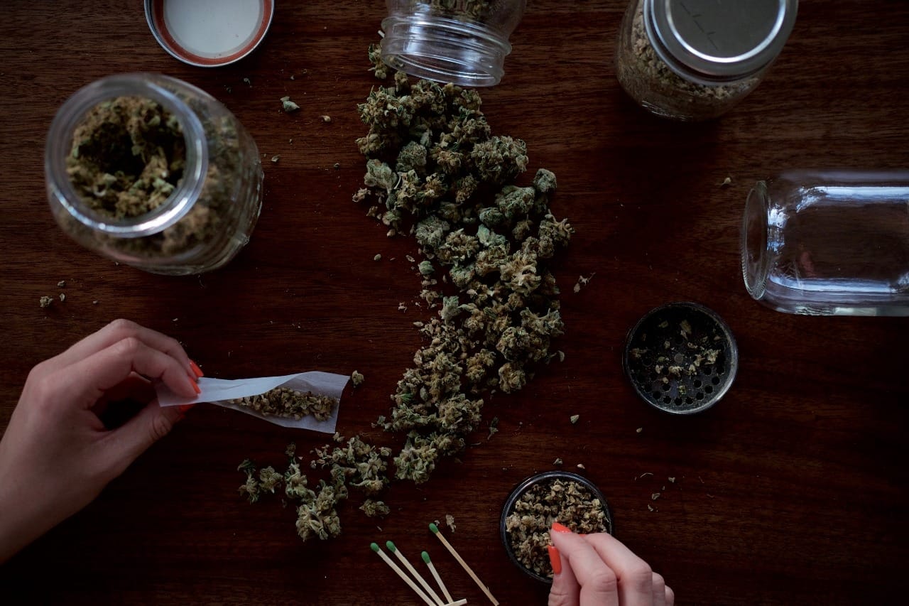 cannabis being rolled into a joint