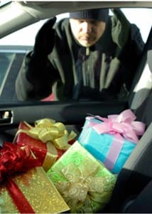 Person looking at the wrapped gifts in the car during the holidays