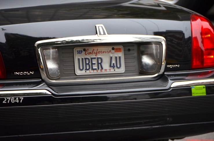 California license plate on an Uber car