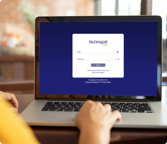 A person accessing the McDougall web portal from the comfort of their home.