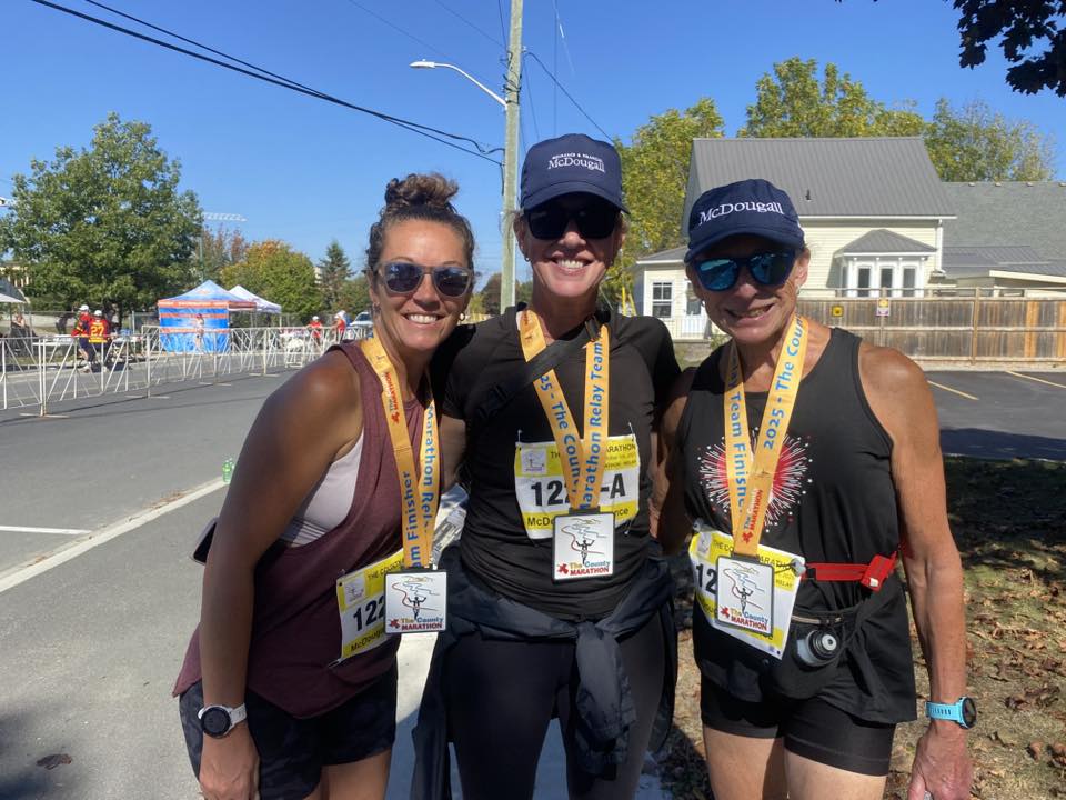 Joyce Stewart competing in the Prince Edward County Marathon with her fellow McDougall Insurance employees